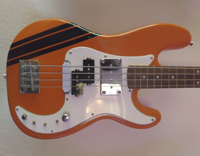 orange p bass with 3 pickups